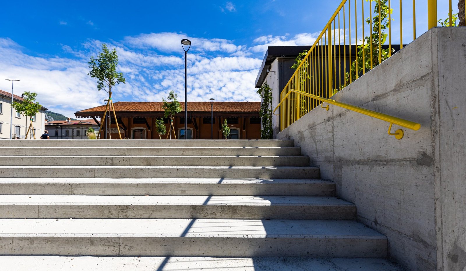 The steps and the yellow handrail
